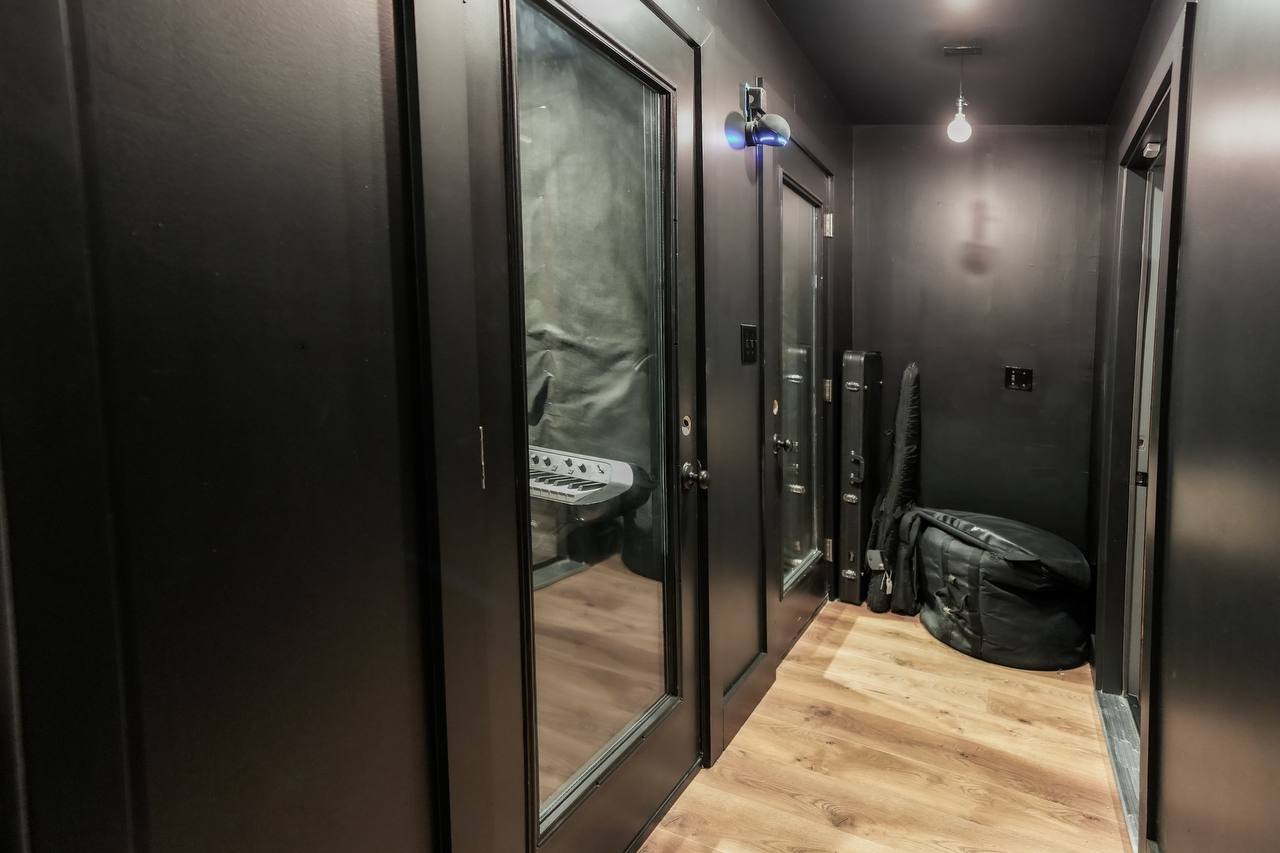 Isolation booths — dark hallway, glass windows